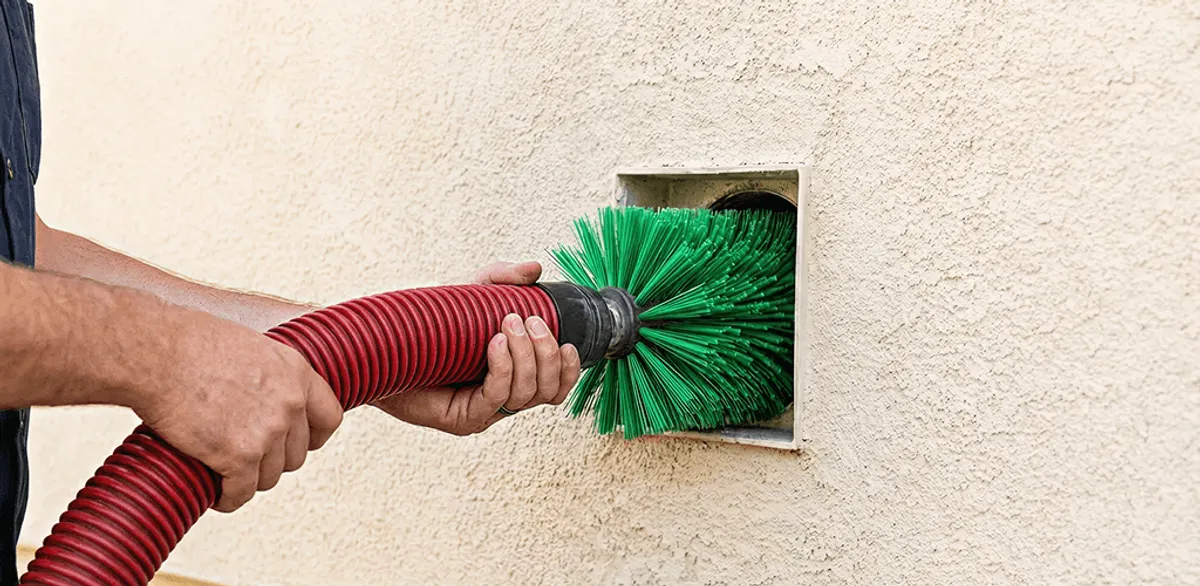 Air duct cleaning brush removing debris from a vent opening in Chandler, AZ
