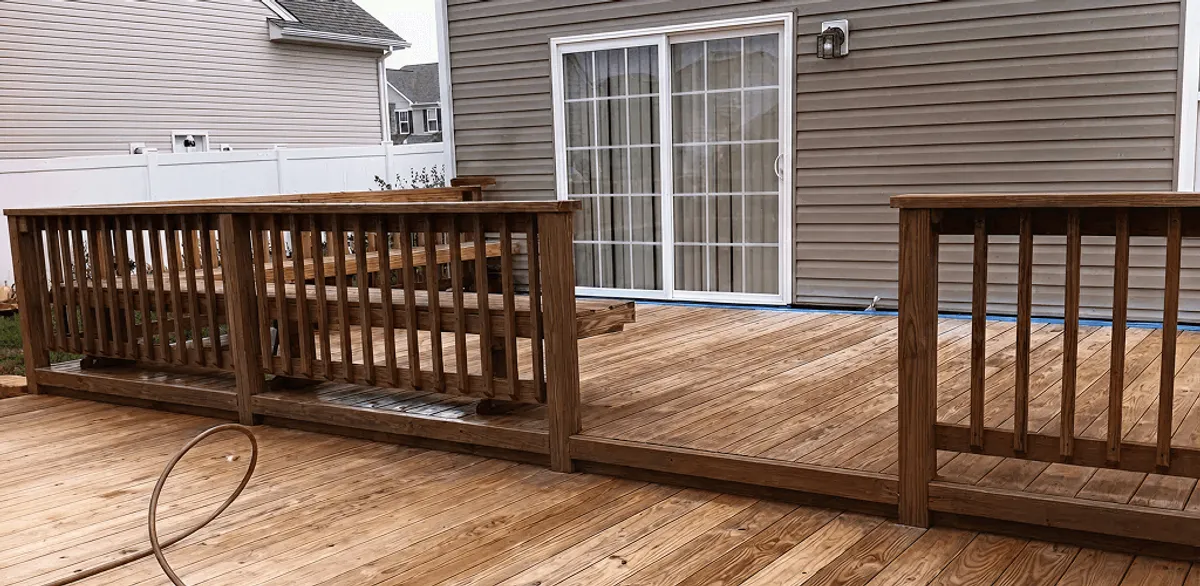Deck sealing service protecting a backyard wood deck and railings in Chandler, AZ