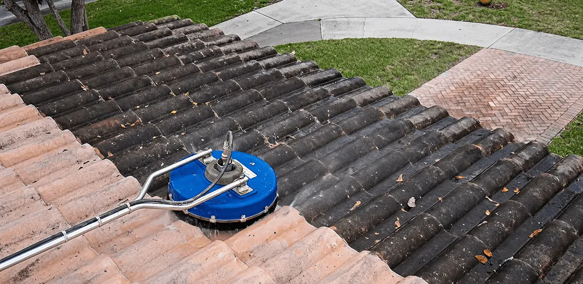 Roof pressure cleaning removing debris and buildup from roof tiles in Chandler, AZ